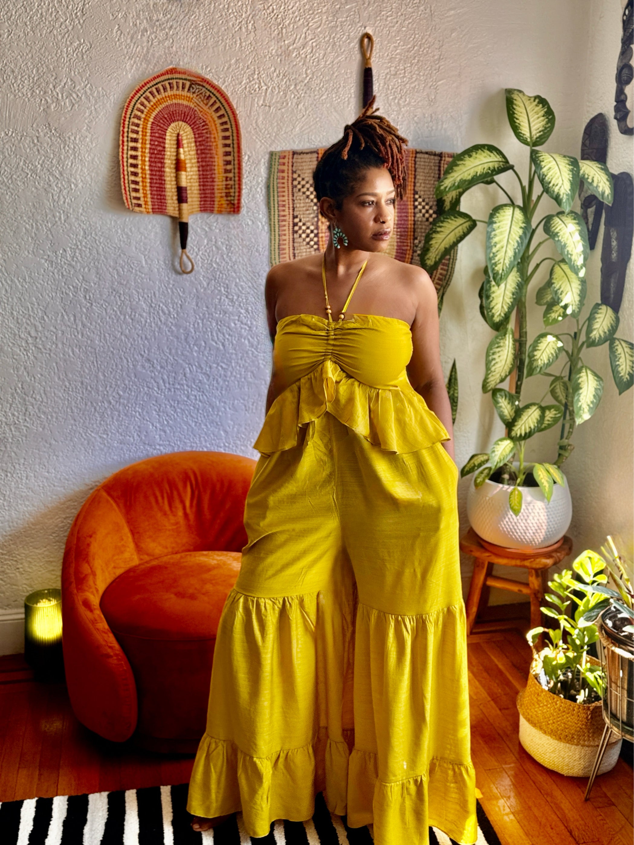 Full-body shot of Butterfly Ruffle Romper highlighting halter neckline, cinched waist, and breezy wide legs.”