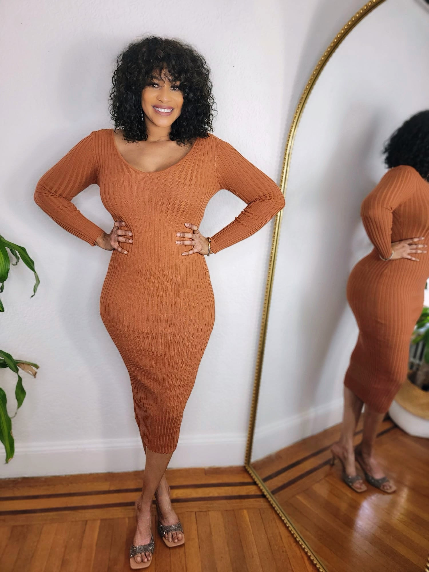 Woman wearing the Cinnamon Curve Ribbed Midi Dress in warm brown tone.