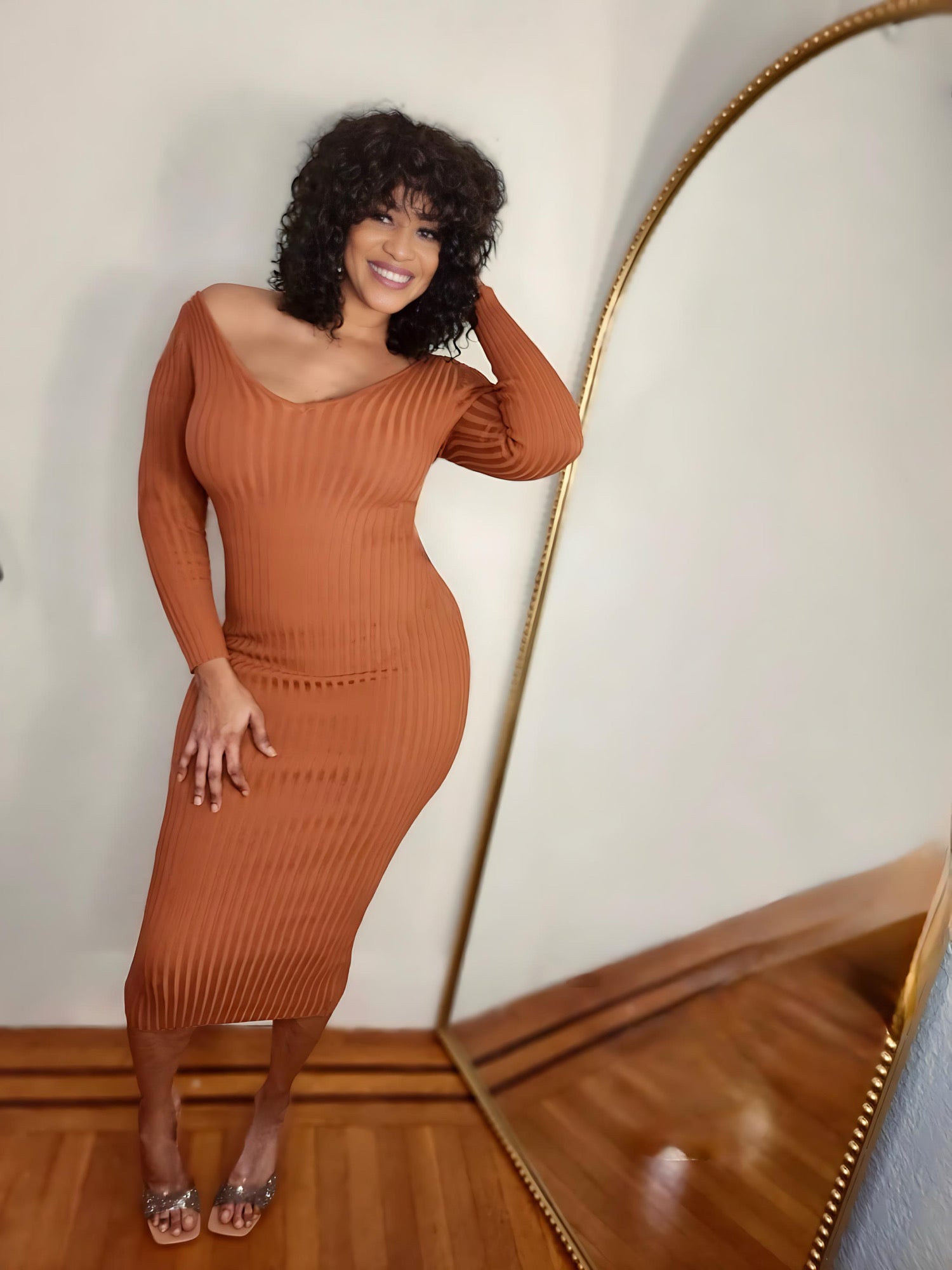 Woman wearing the Cinnamon Curve Ribbed Midi Dress in warm brown tone.