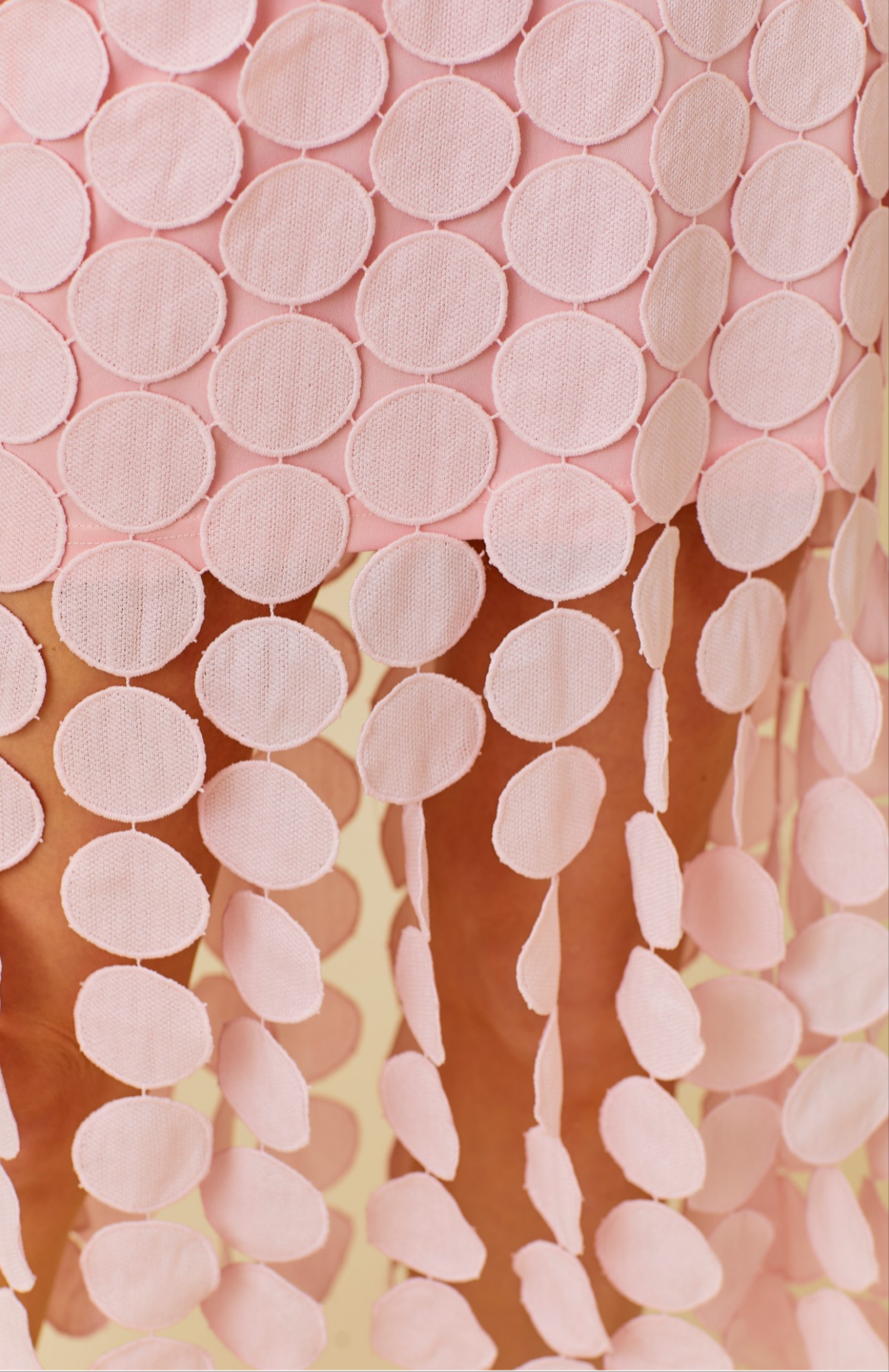 Close-up of pink tiered circle hem fabric showing the layered texture of the Circled Then Ends Midi Dress.