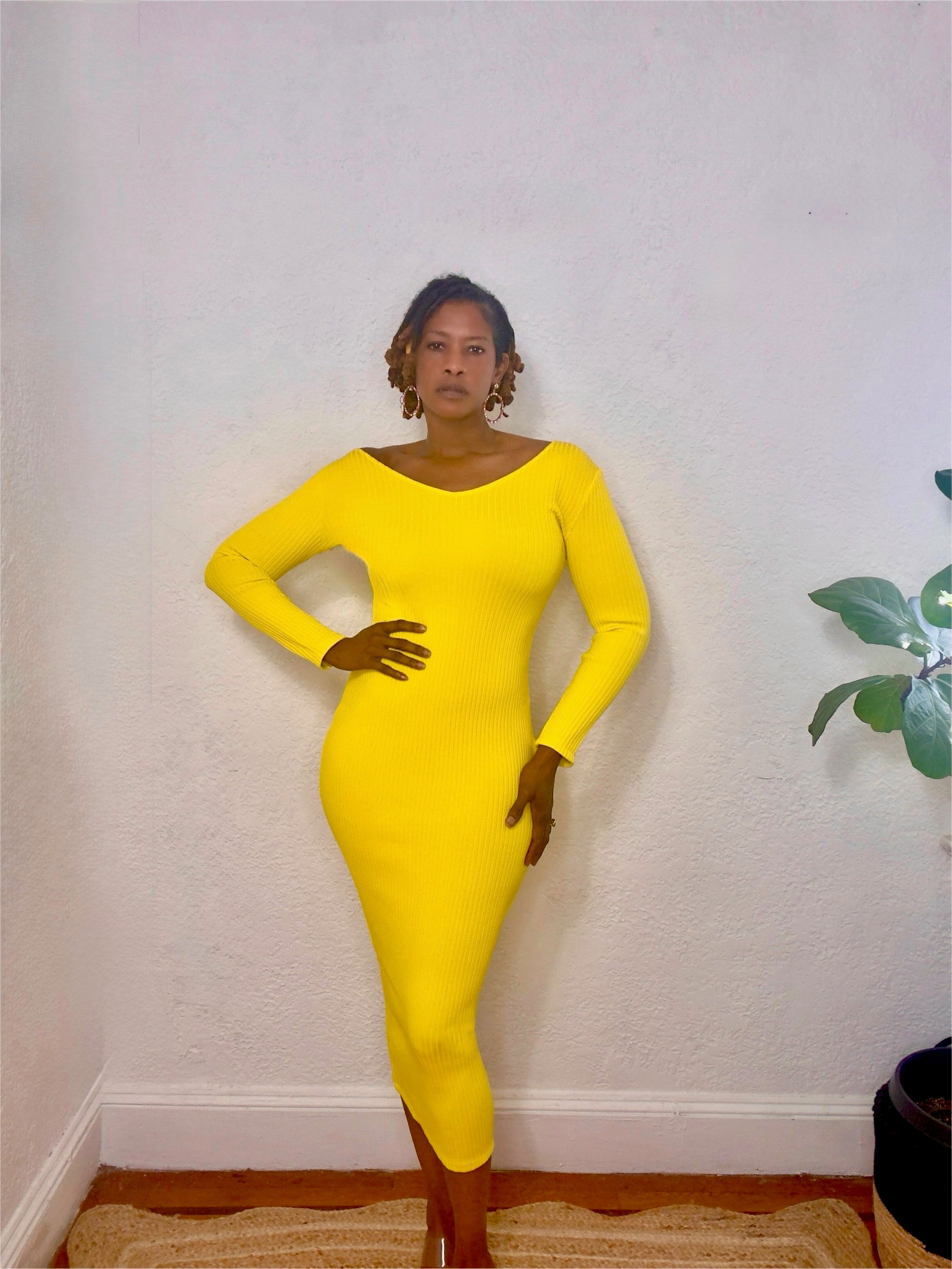 Full-body shot of model wearing the Citrine Glow Ribbed Midi Dress in vibrant yellow, standing confidently.