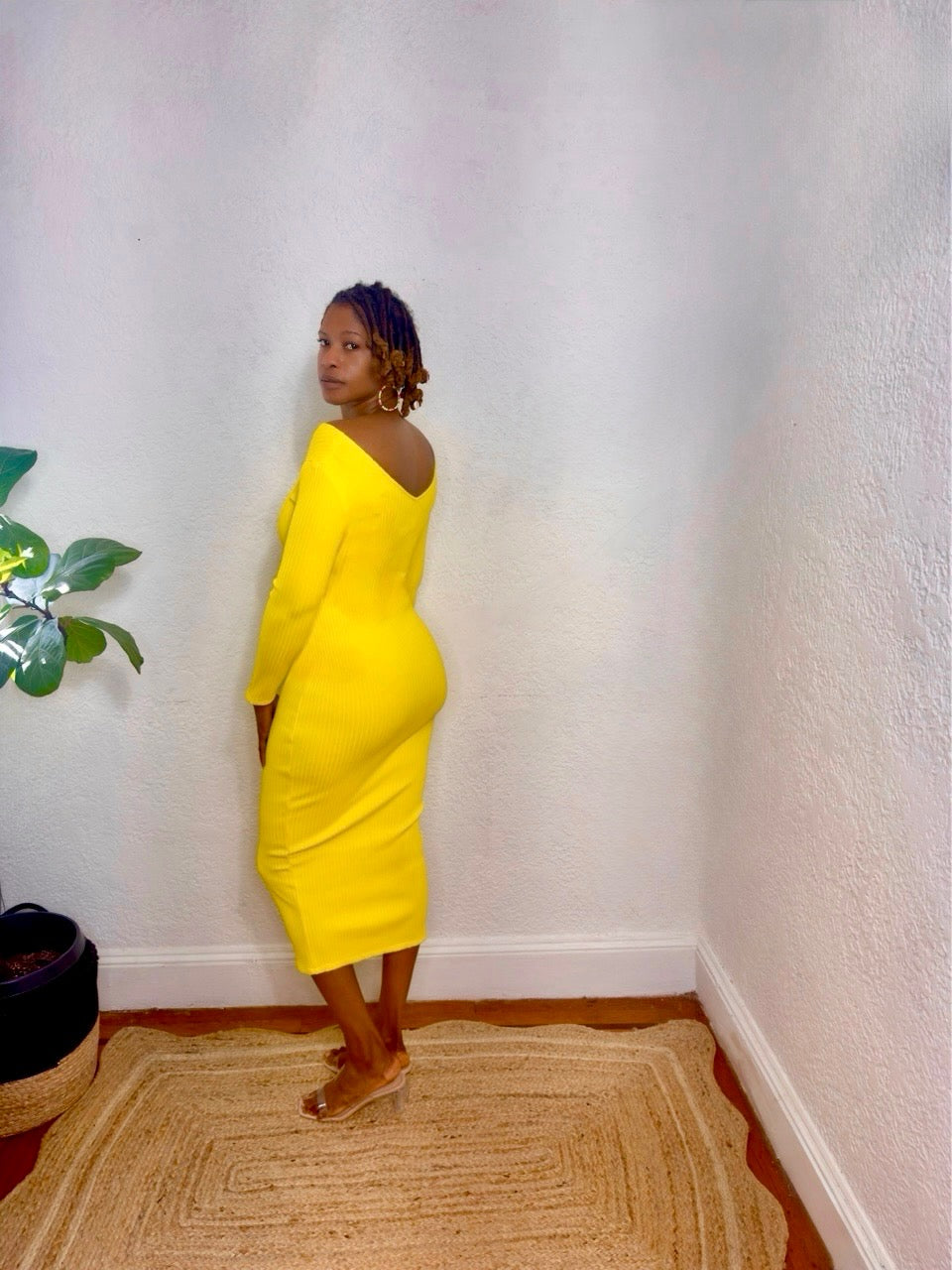 Close-up of the ribbed knit detailing and neckline design.