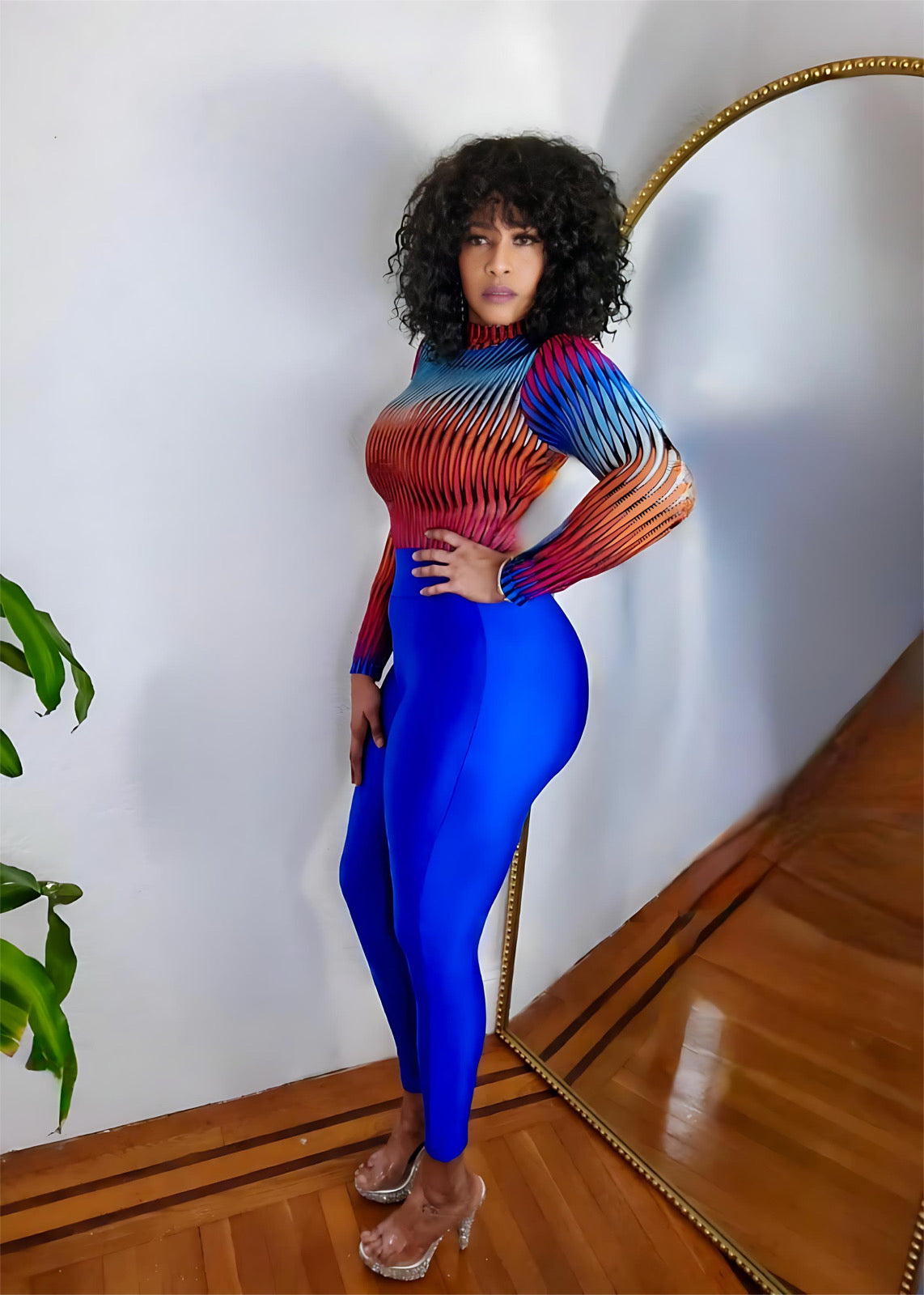 Side view of cobalt blue leggings highlighting curve-enhancing design.
