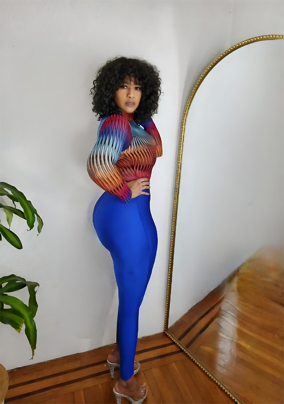 ull-length photo of blue leggings styled with a white bodysuit.