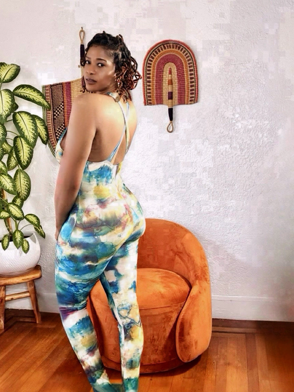 Back view of the Earth Goddess Jumpsuit highlighting smooth drape and flowy fabric.