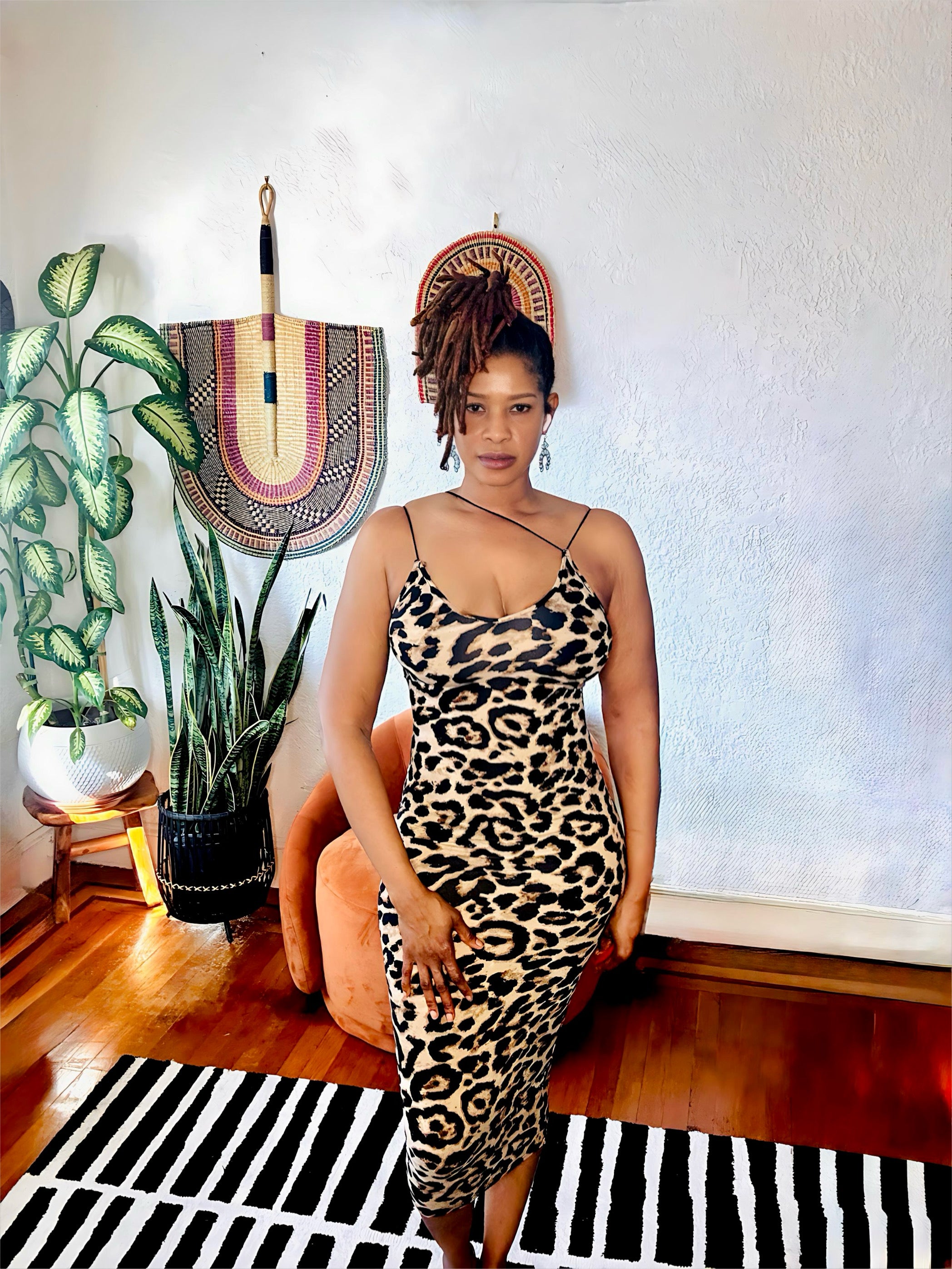 Full-body pose capturing the confident, bold look of the leopard print.