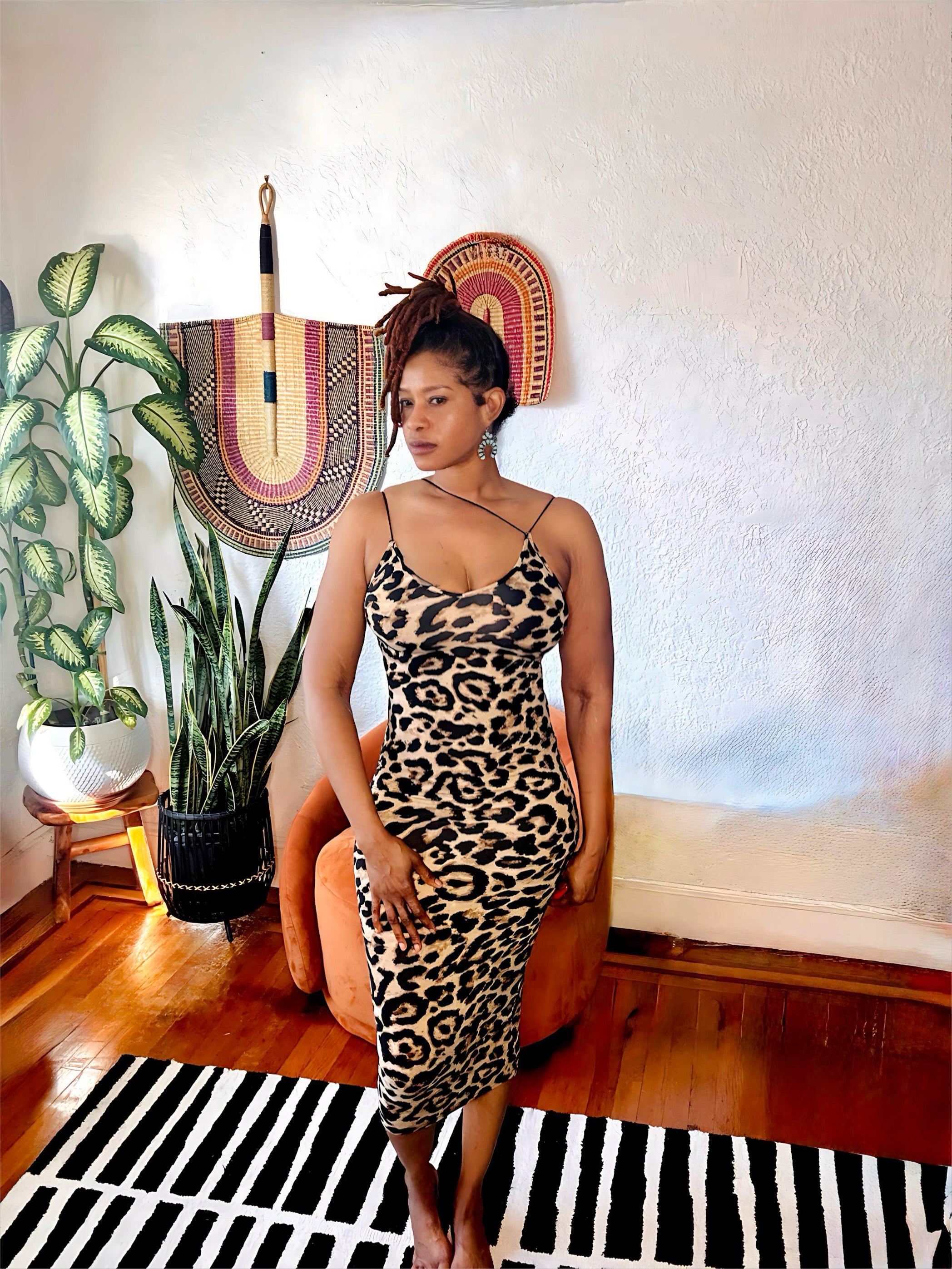 Model wearing the Fierce & Flawless Leopard Midi Dress featuring a sleek, body-hugging fit and adjustable straps.