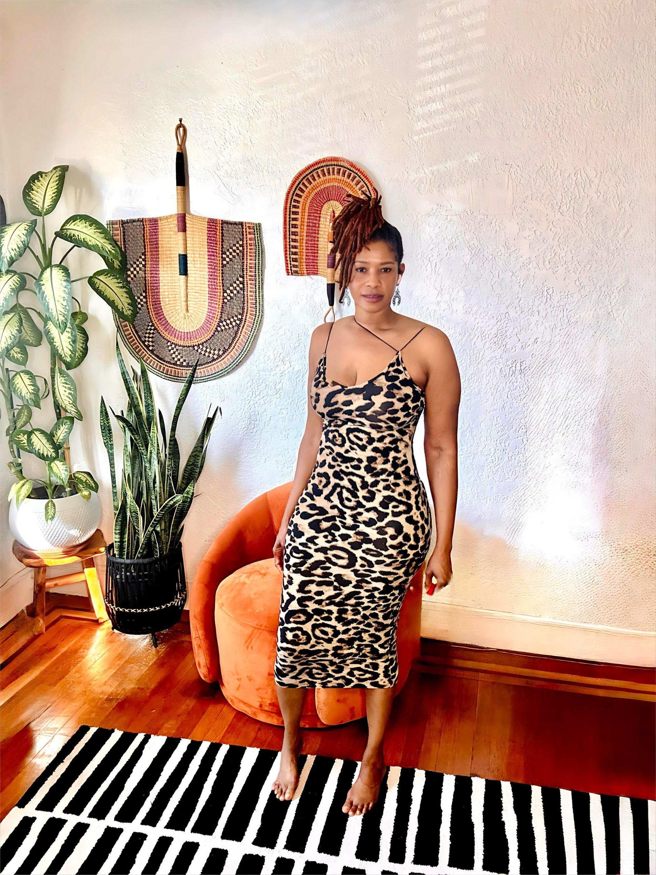 Side view highlighting the curve-defining silhouette and leopard print.