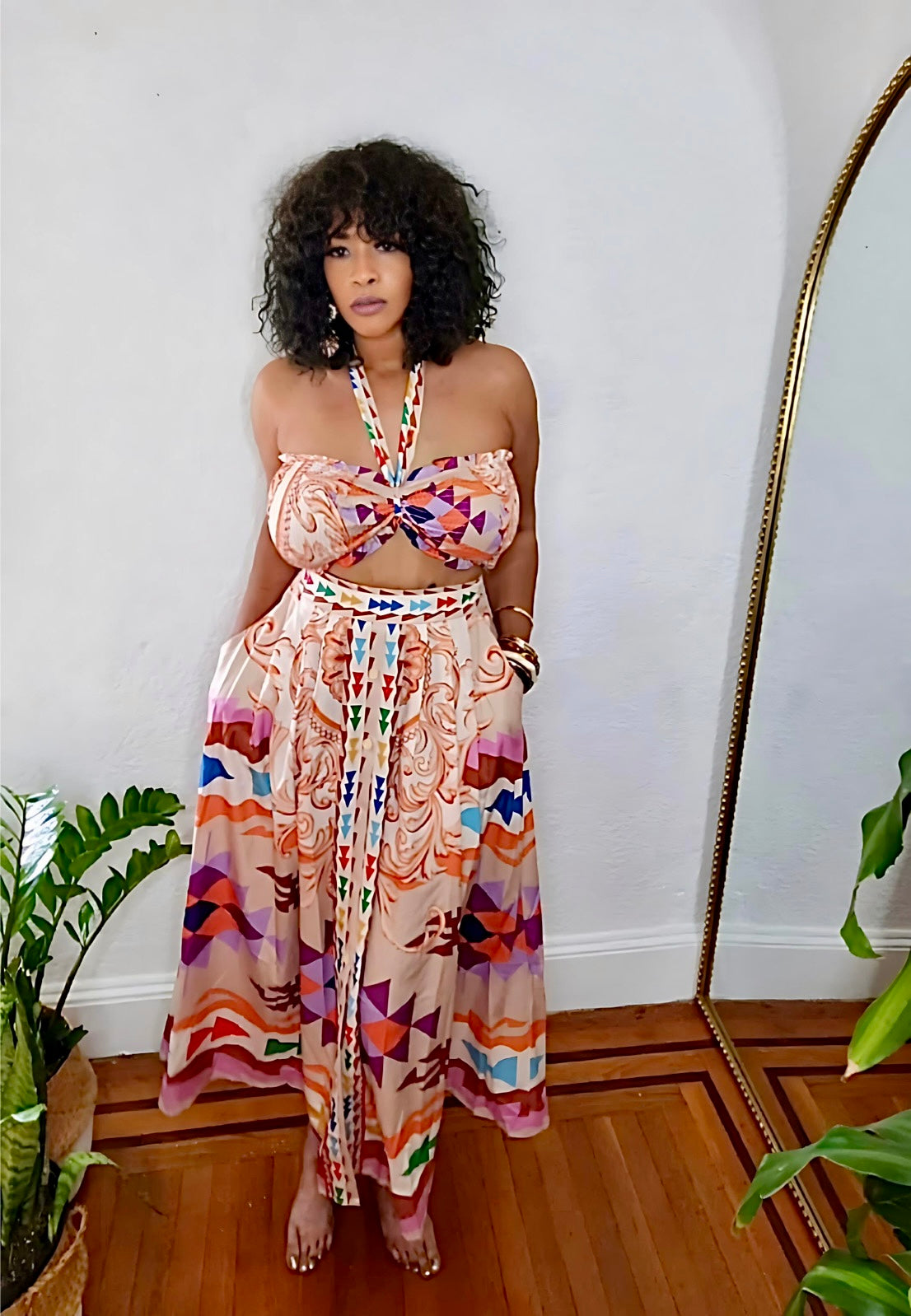 Close-up of lightweight fabric and tribal-inspired detailing.