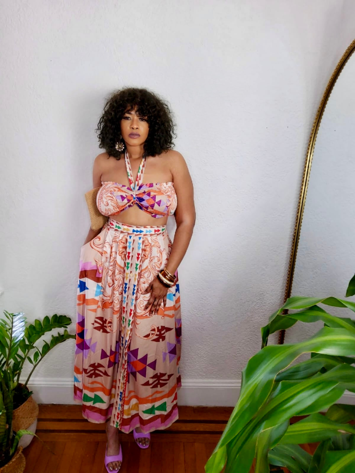 Model wearing Heritage Heatwave Set — multicolor tribal-print bandeau top and wide-leg pants.