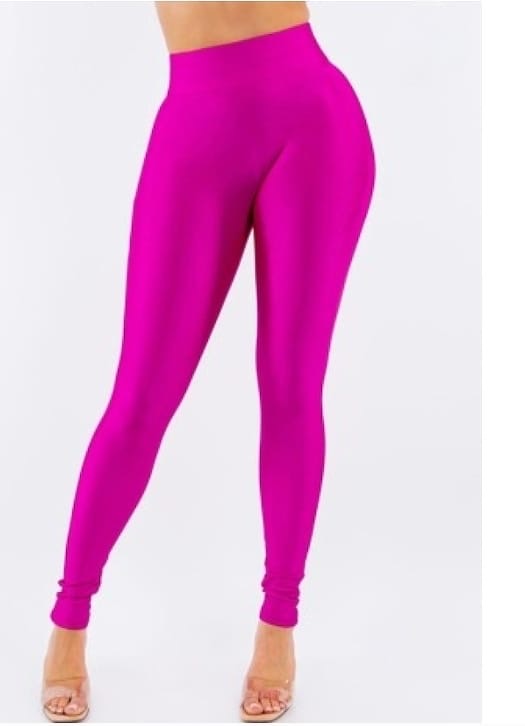 Woman wearing Hot Shot Fuchsia Leggings from MonologueClosets — bright pink high-waisted leggings with ultra-stretch comfort and a body-hugging finish.
