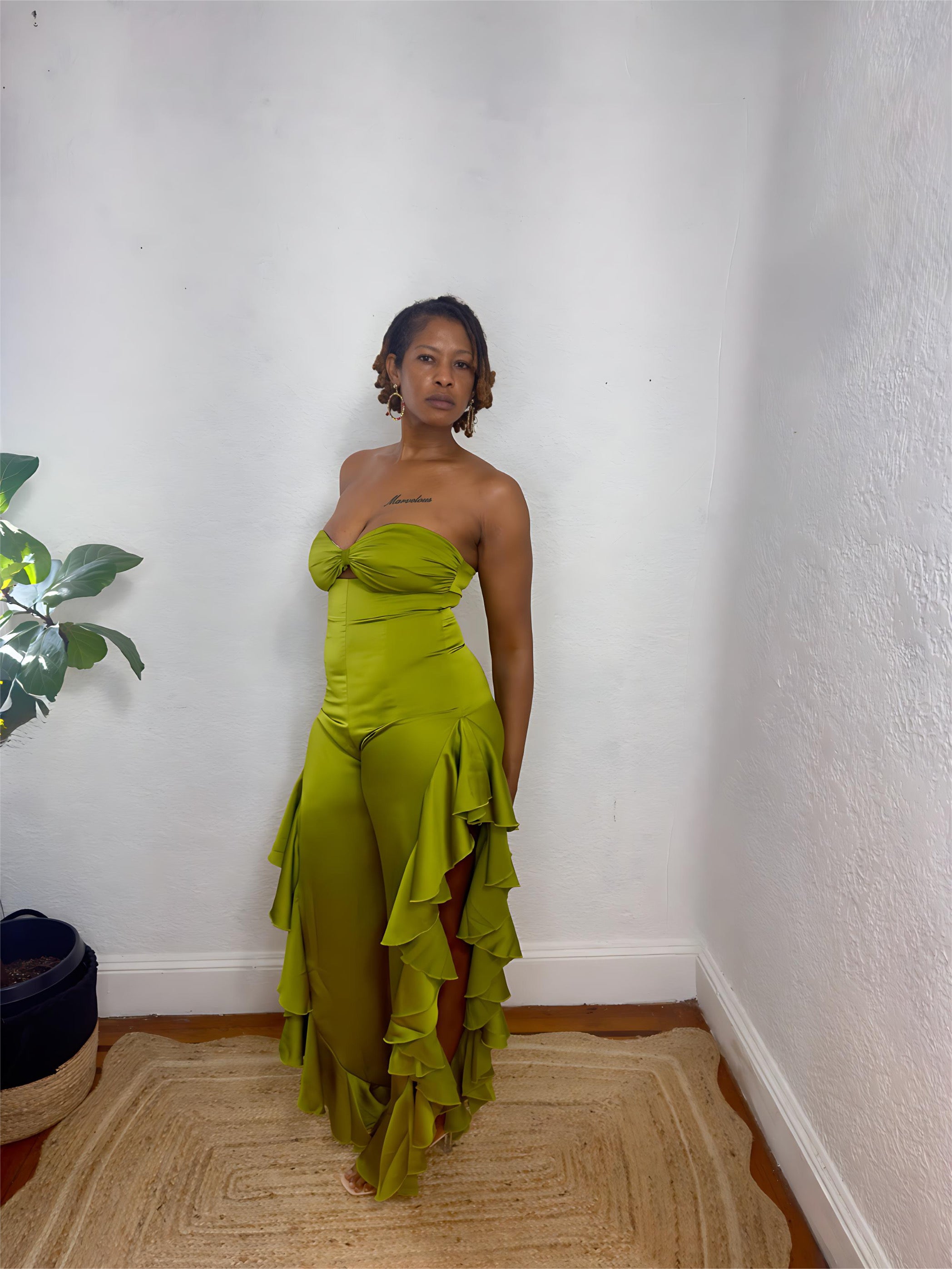 Side view of the Island Temptress Jumpsuit showing fitted bodice and open neckline.