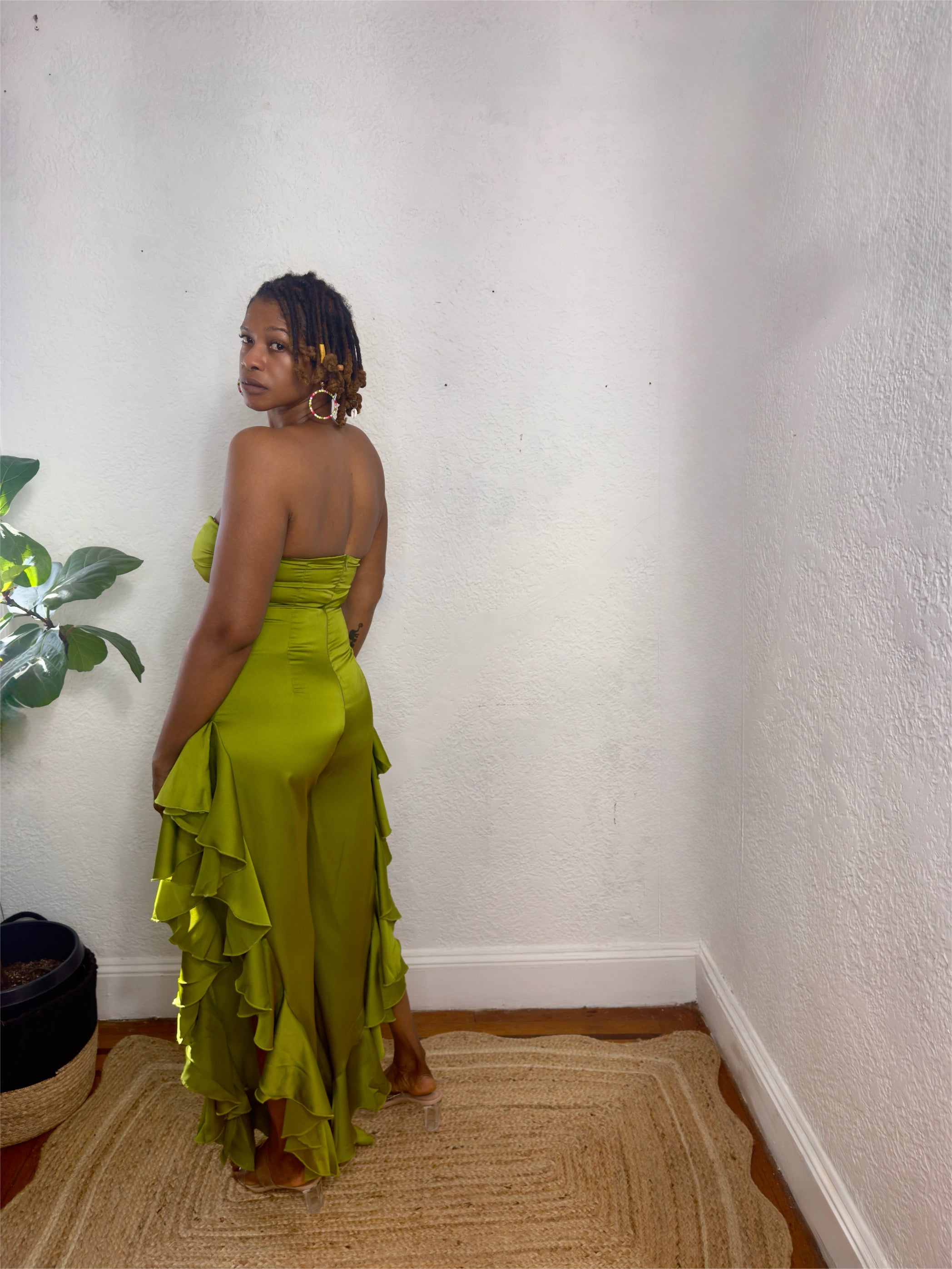 Back view of tropical print jumpsuit highlighting relaxed, elegant fit.