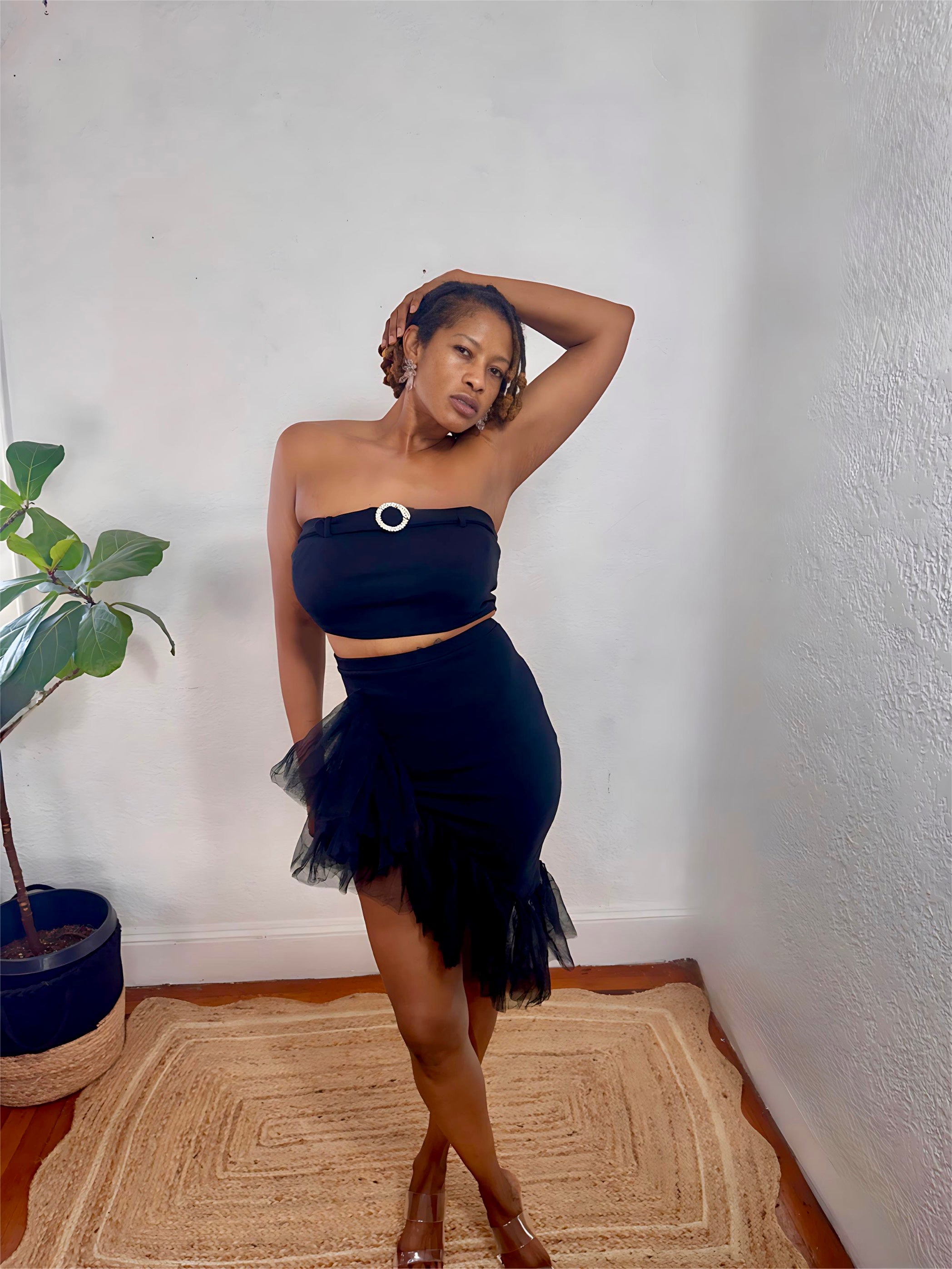 Model wearing the Midnight Flirt Set in black — strapless crop top with layered tulle skirt, perfect for night-out glam from MonologueClosets.