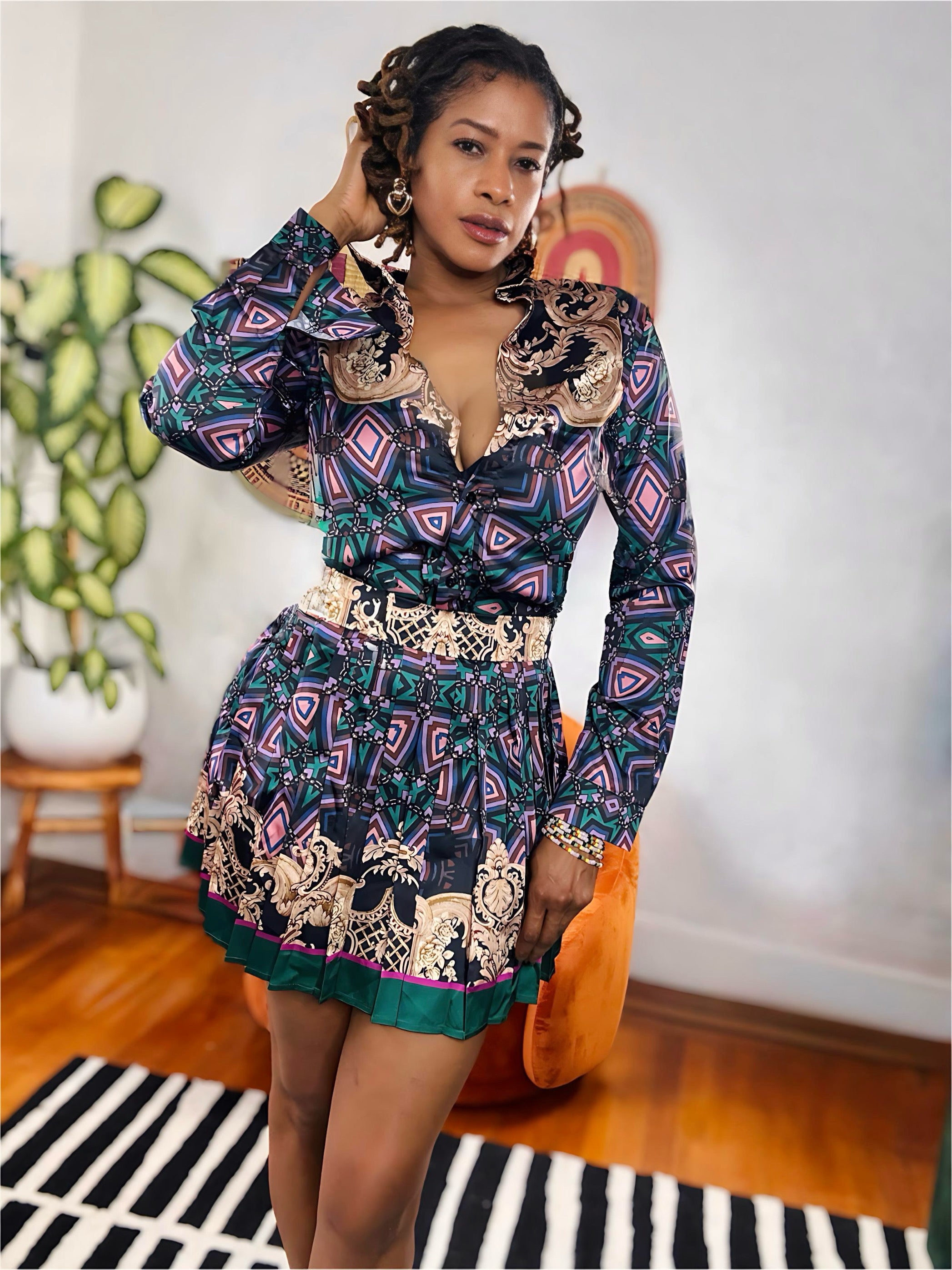 Model wearing Royal Remix Set featuring multicolor baroque print blouse and mini skirt.