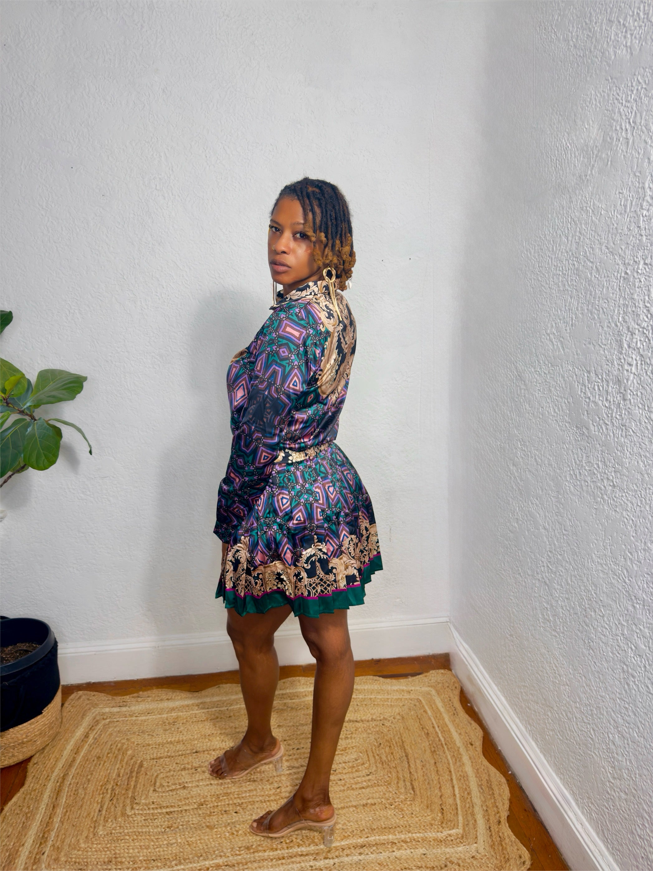 Close-up of luxe detailing and statement baroque pattern on the matching set.