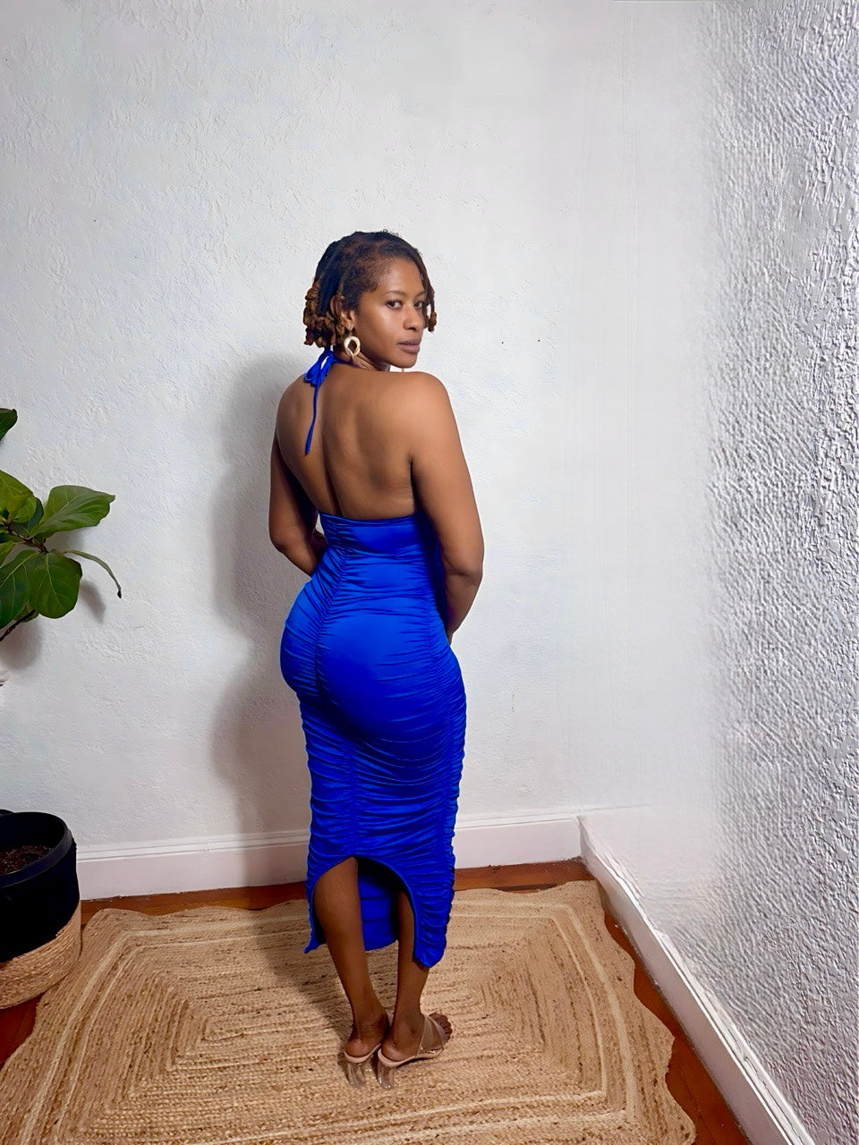 Back view of ruched blue dress with adjustable straps.