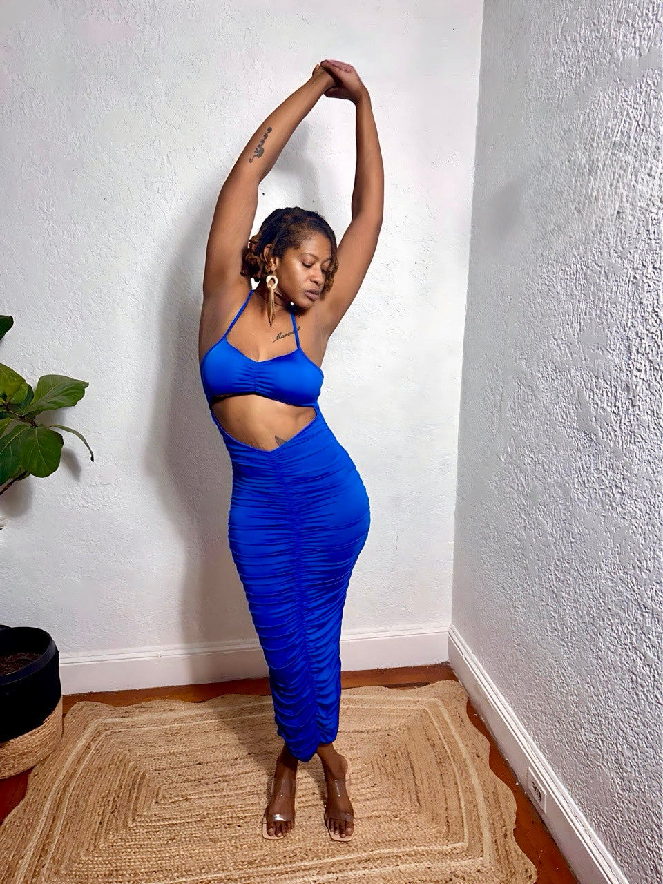 Full-length shot of royal blue midi dress showing curve-hugging fit.