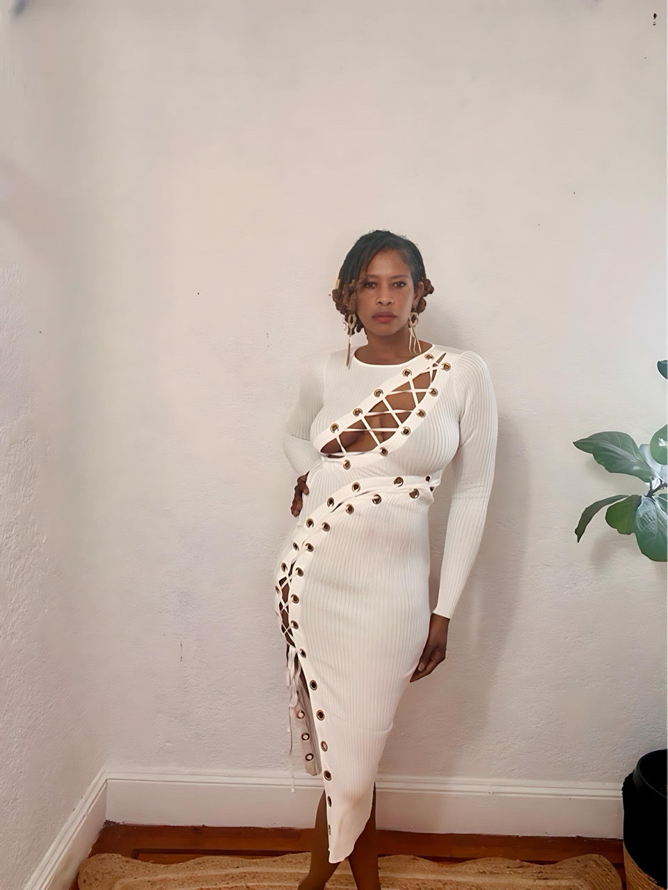 Model wearing the Twist & Lace Midi Dress in white — lace-up front detail and ribbed texture