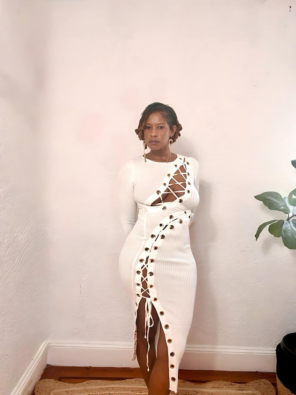 Close-up of lace-up design and gold eyelet detailing on the Twist & Lace Midi Dress.”