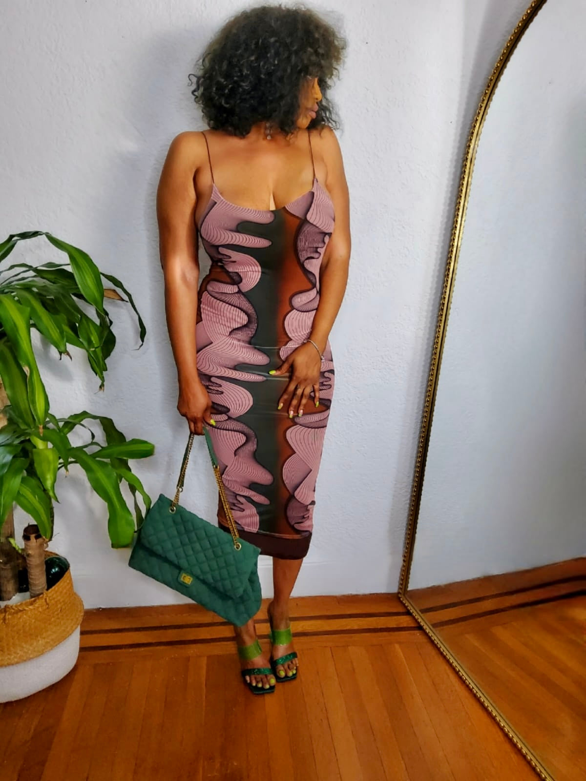 Close-up of the Urban Muse Printed Midi Dress fabric showing abstract patterns and soft stretch finish.