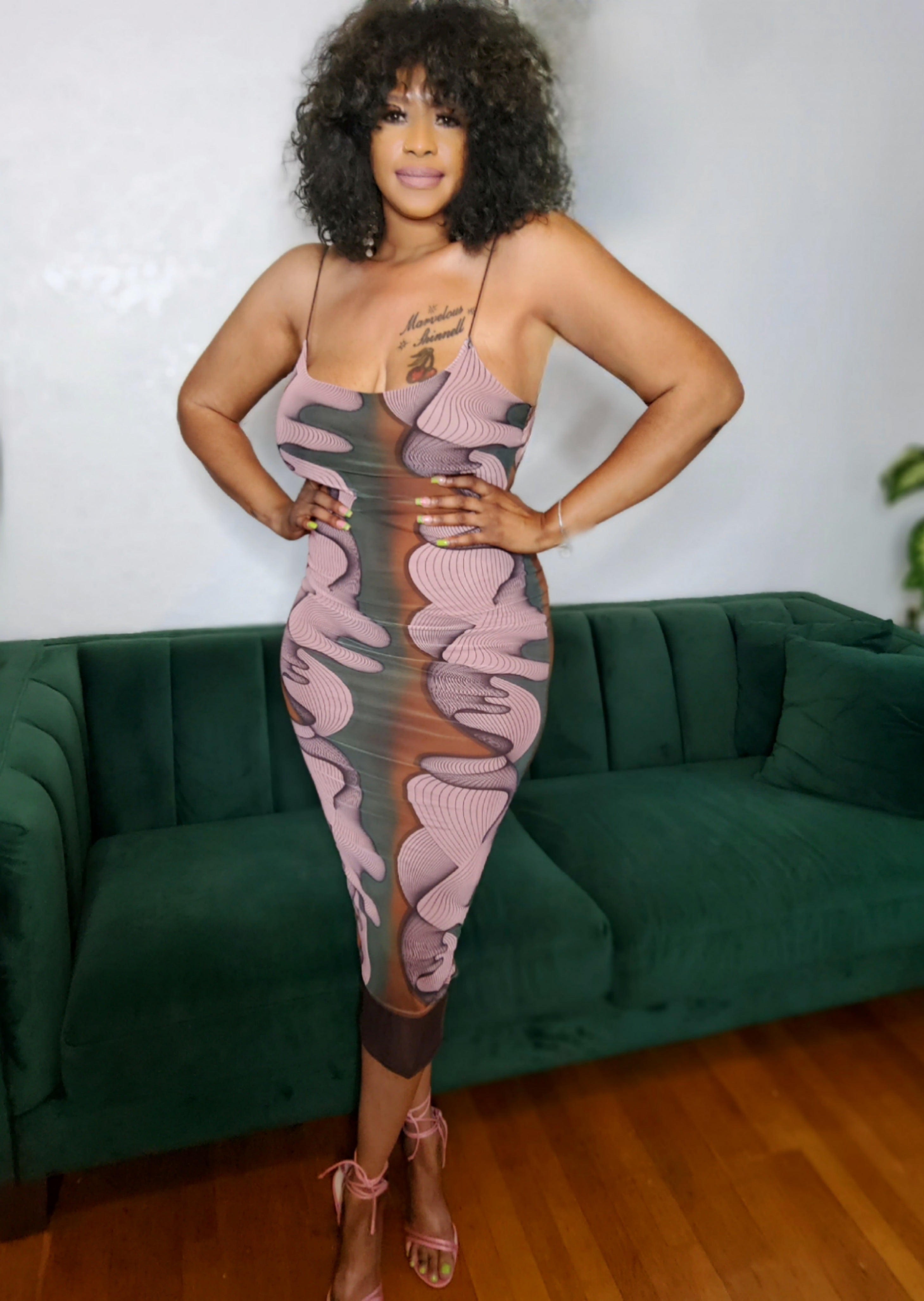 Model wearing the Urban Muse Printed Midi Dress from MonologueClosets — abstract print midi with slim straps and a flattering body-hugging fit.
