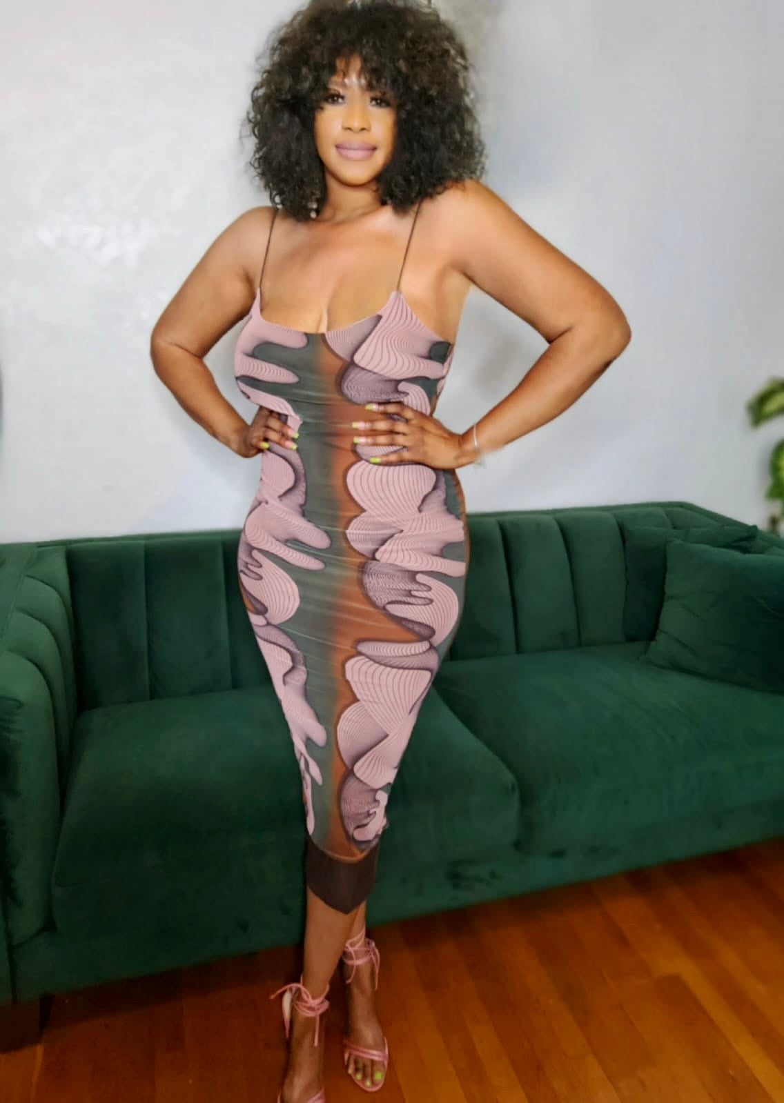 Model posing in the Urban Muse Printed Midi Dress from MonologueClosets — elegant, fitted, and ready for statement occasions.