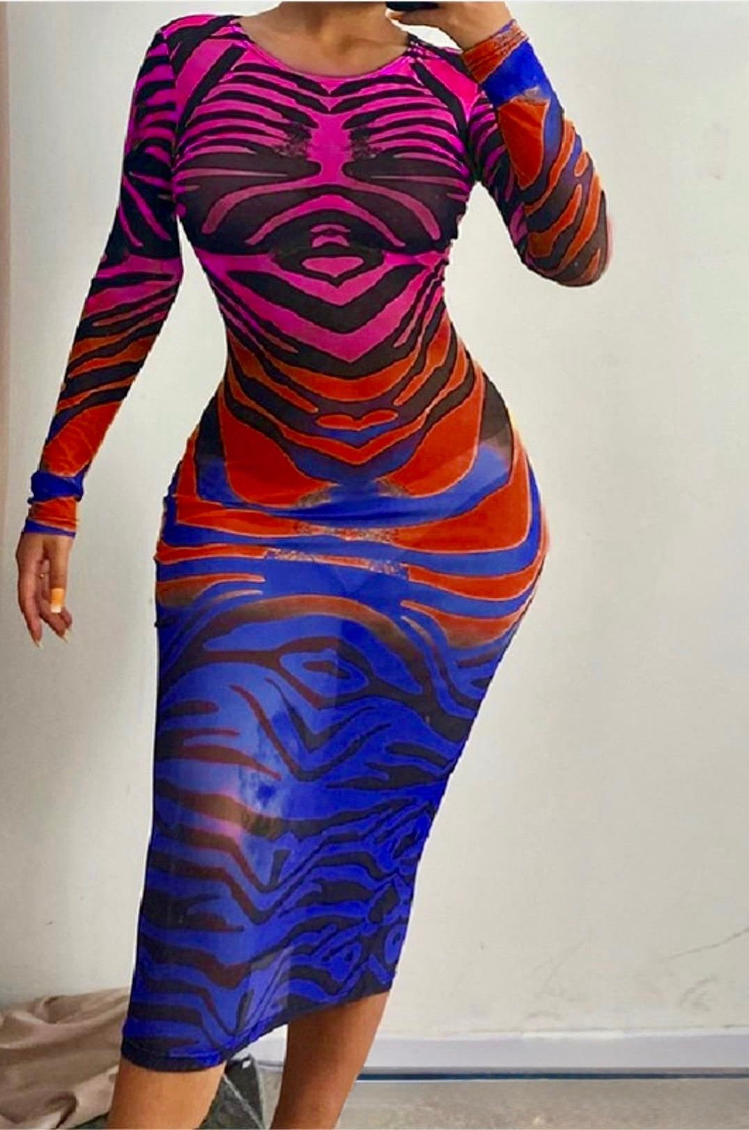 Close-up of the illusion print and sheer fabric texture.