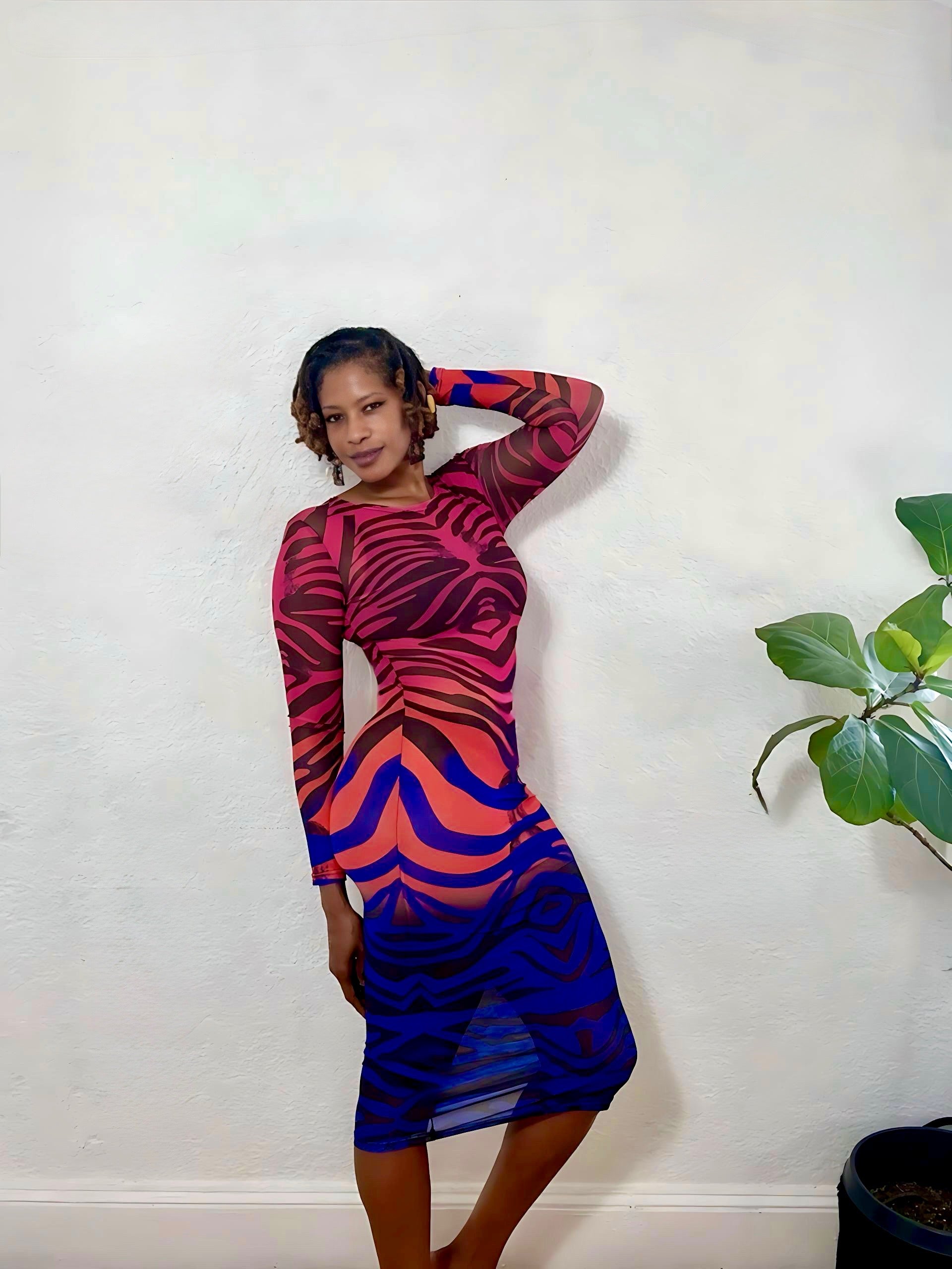 Rear view showing the sleek, fitted design and smooth backline of the dress