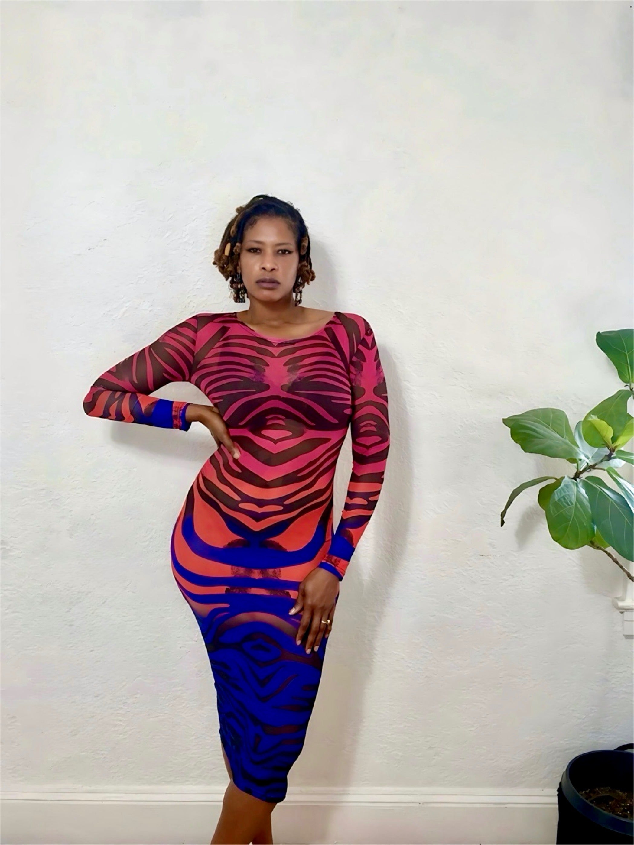 Full-body shot of model wearing the Vivid Illusion Mesh Dress in red and blue gradient, posing confidently.